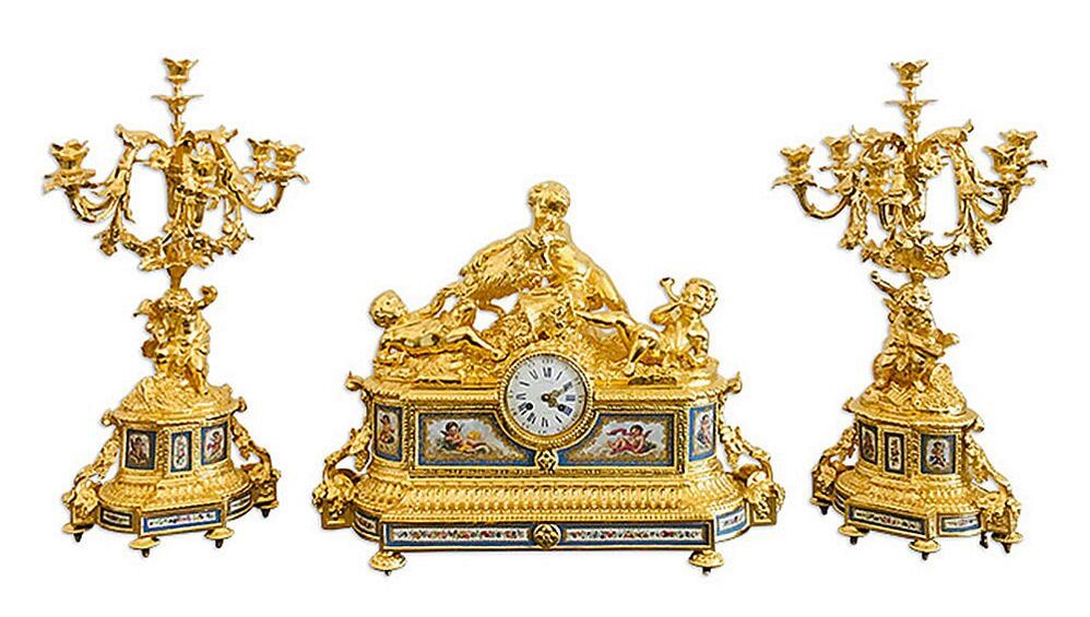 Antique French mantel set with candelabras, meticulously gilded with 24-karat gold leaf by Chelsea Plating Company, exemplifying their gold leafing restoration expertise.