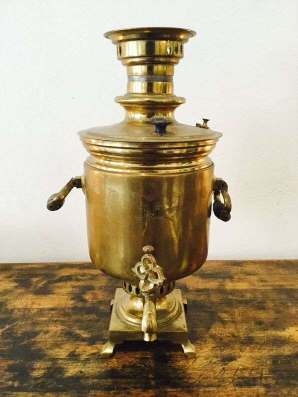 Neglected Russian Samovar before restoration, showing significant tarnish and wear.