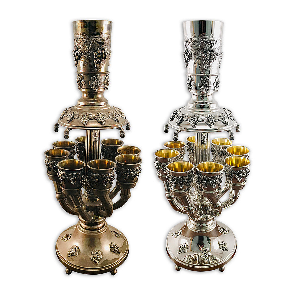  Immaculately refurbished antique sterling silver Judaica wine fountain by Chelsea Plating Company. Witness the captivating beauty and meticulous artistry of this cherished religious item, now gleaming with renewed brilliance. The fountain underwent professional cleaning and polishing, while the insides of the cups were meticulously plated with 24k gold. Rely on the expertise of Philadelphia's renowned restoration workshop, committed to preserving and revitalizing treasured Judaica heirlooms.