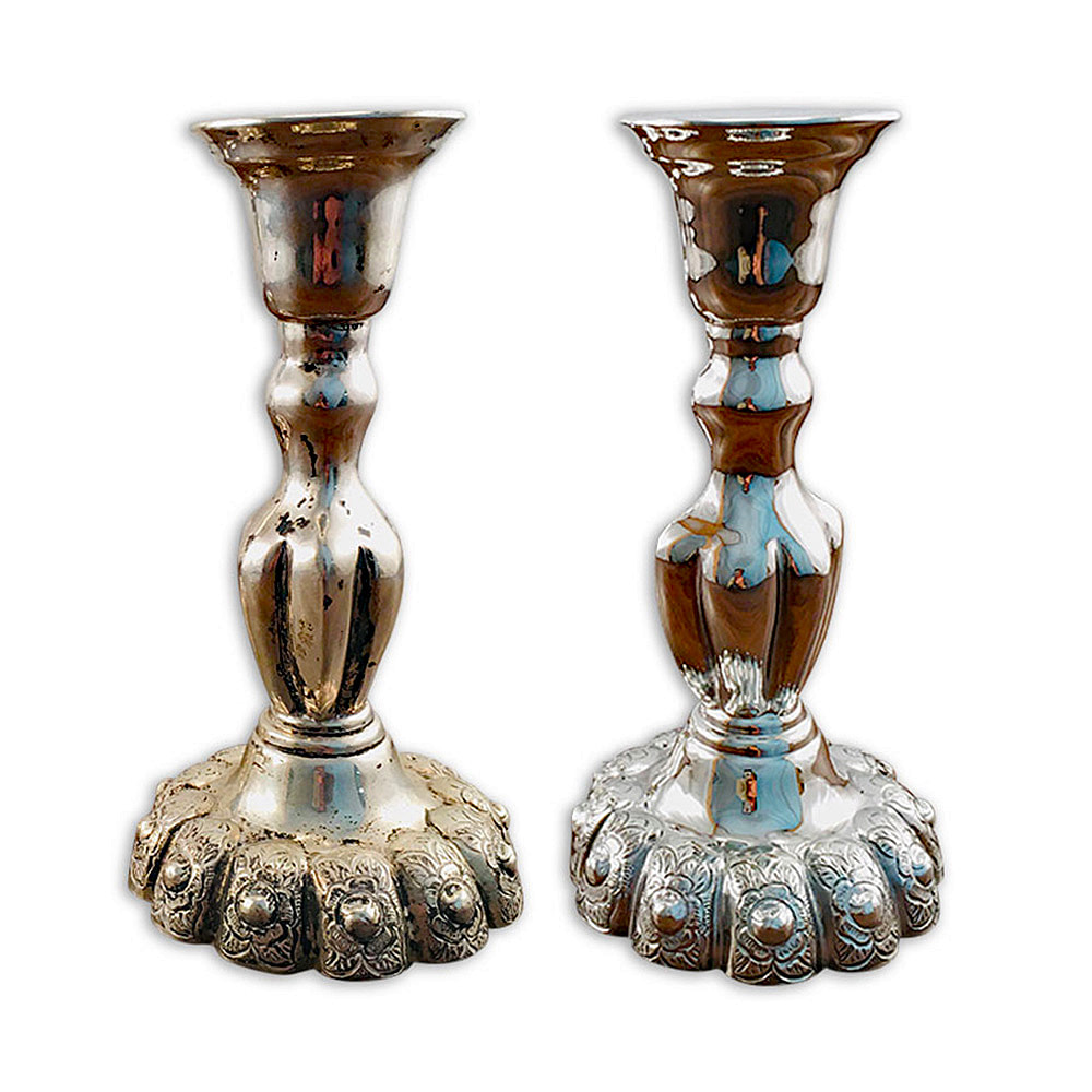 PiImpeccably restored, an ornate antique sterling silver candlestick shines with renewed splendor after professional cleaning and polishing by Chelsea Plating Company. Witness the captivating beauty and meticulous attention to detail in this timeless treasure. Rely on the expertise of Philadelphia's esteemed restoration workshop to preserve and enhance the elegance of cherished sterling silver pieces.cture
