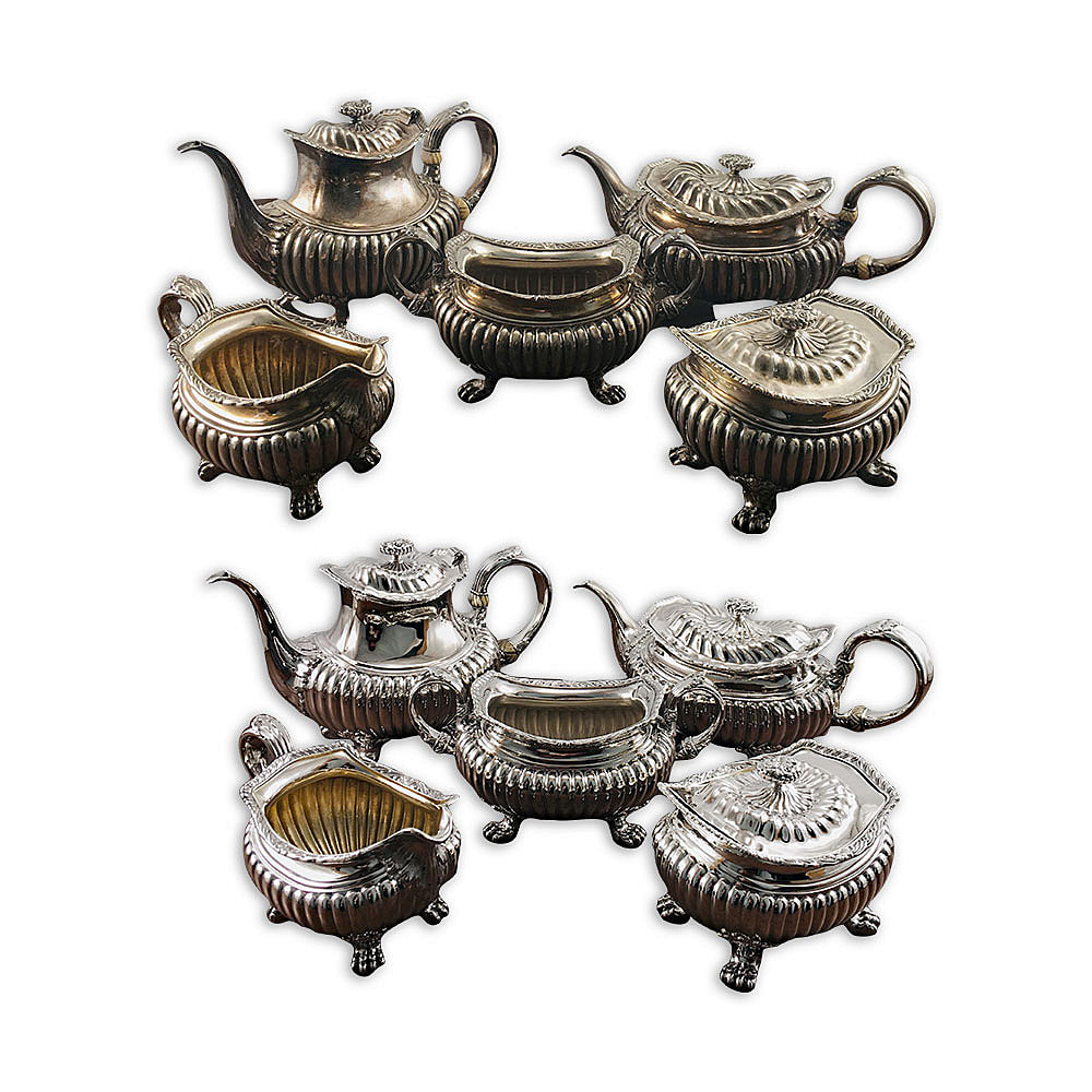Step into a world of refined sophistication with an antique estate sterling silver tea set, meticulously revitalized by the esteemed artisans at Chelsea Plating Company. Immerse yourself in the meticulous restoration process, where years of tarnish and wear are expertly removed, revealing the exquisite luster of the sterling silver. Prepare to be enchanted by the luxurious detail--a delicate 24k gold wash adorns the insides of each tea set piece, imparting a captivating golden hue and enhancing its intrinsic elegance. Chelsea Plating Company's passion for antique silver restoration shines in their meticulous craftsmanship, ensuring this tea set becomes a cherished heirloom, cherished for generations to come.