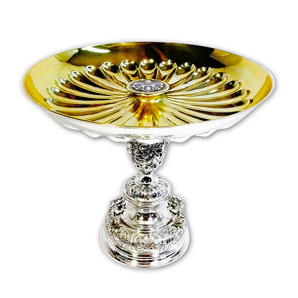 Skillfully restored by Chelsea Plating Company, this German silver compote showcases an interior adorned with 24k gold plating. The careful restoration of the silver exterior and the opulent gold plating inside reveal a seamless fusion of craftsmanship and elegance. This remarkable piece, demonstrating expertise in silver restoration, gold plating, and fine art restoration, resonates with timeless beauty and sophistication, poised to captivate and enchant in any refined ensemble.