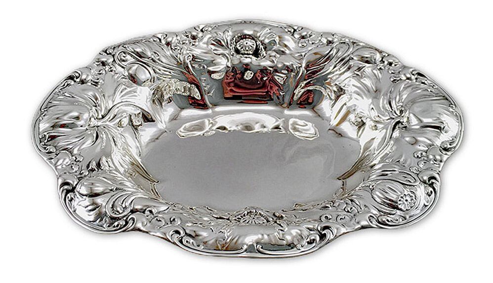 Ornate sterling silver bowl, adorned with intricate details, skillfully revitalized by Chelsea Plating Company, showcasing cleaning, polishing, and refinishing mastery, emblematic of their expertise in antique sterling silver restoration.