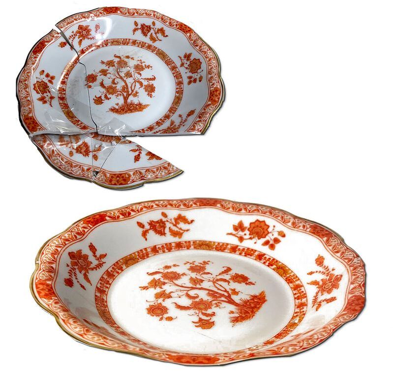 Restored antique fine china plate by Chelsea Plating Company, expertly rejoined to radiate renewed elegance, showcasing their commitment to reviving delicate porcelain pieces and preserving historical value.