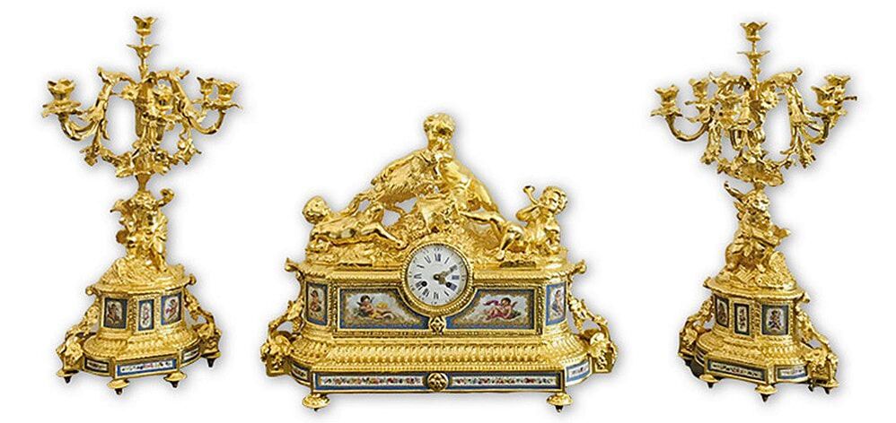 French antique mantel set exquisitely restored by Chelsea Plating Company with 24-karat gold leaf, highlighting intricate carvings and ornate details, embodying mastery in gilding and antique restoration.