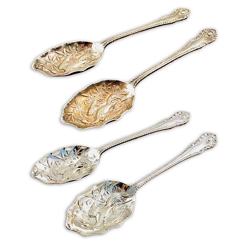 Experience the refined beauty of a pair of sterling silver serving spoons, expertly restored by Chelsea Plating Company. Witness the intricate patterns and exquisite craftsmanship that define these timeless pieces. Meticulously repaired and polished to a flawless shine, these spoons have regained their original splendor. Let the restored elegance of these serving spoons enhance your dining experience, a testament to the exceptional restoration skills of Chelsea Plating Company.